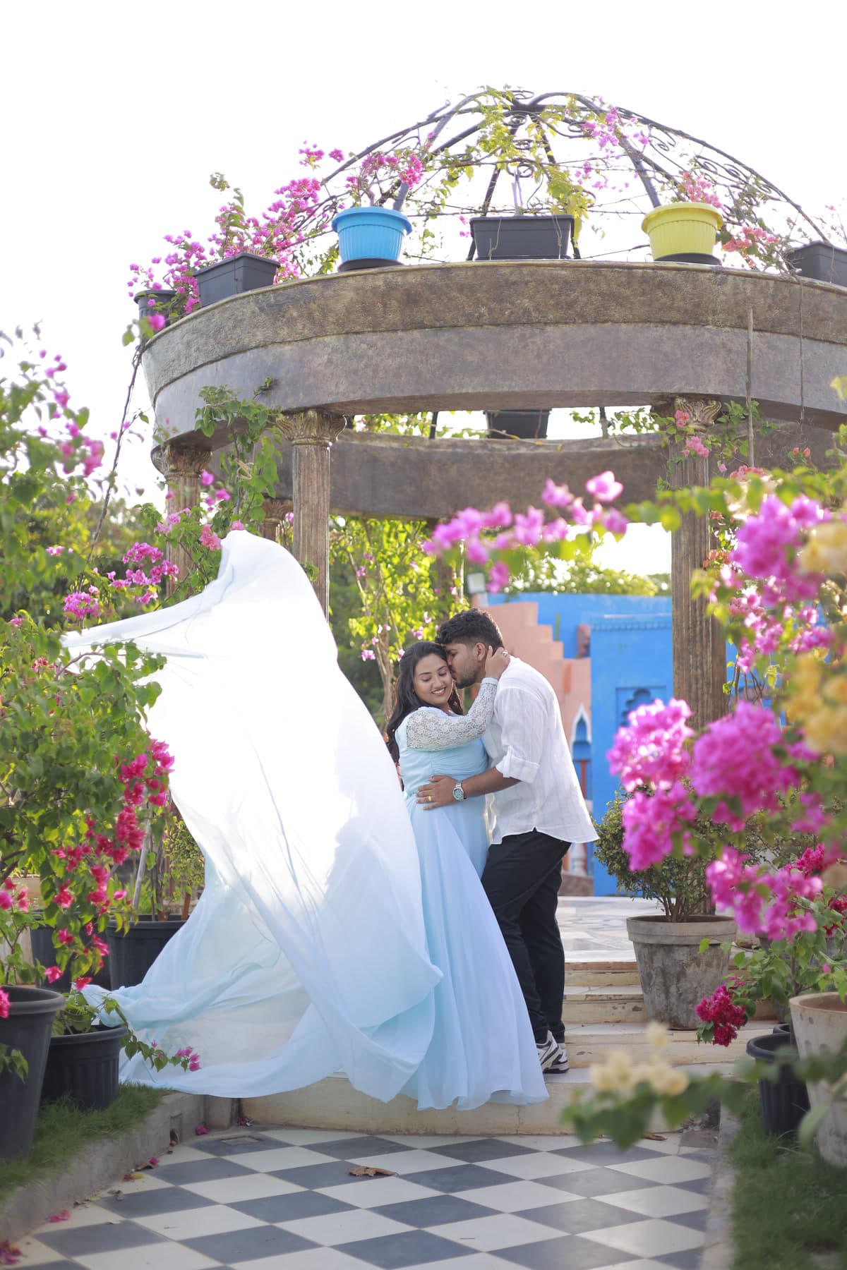 Silhouette of a couple inside an outdoor stone gazebo